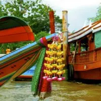 Long-tail boat along the banks of the Chao Phraya River, Bangkok, Thailand