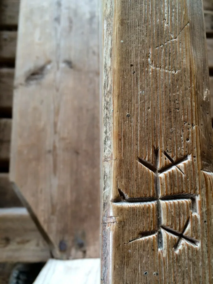 Carving in pew at the parsonage in Maakalla Island, Finland
