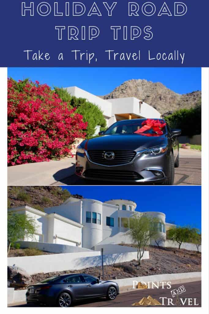 Holiday Road Trip Tips: Take a Trip, Travel Locally, silver Mazda6 with a white house and rock mountain, blue sky, car with a giant red holiday bow
