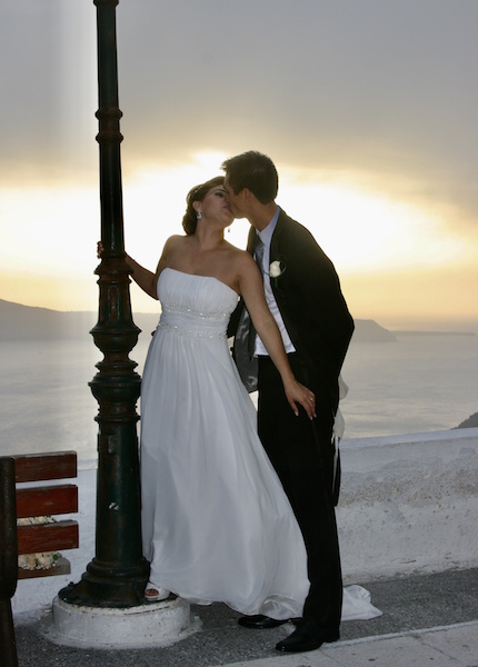 Bride and Groom kissing by the sea