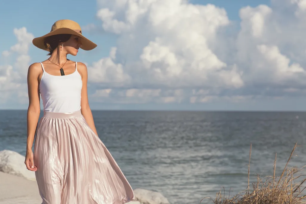 Bride in pink and white on the beach