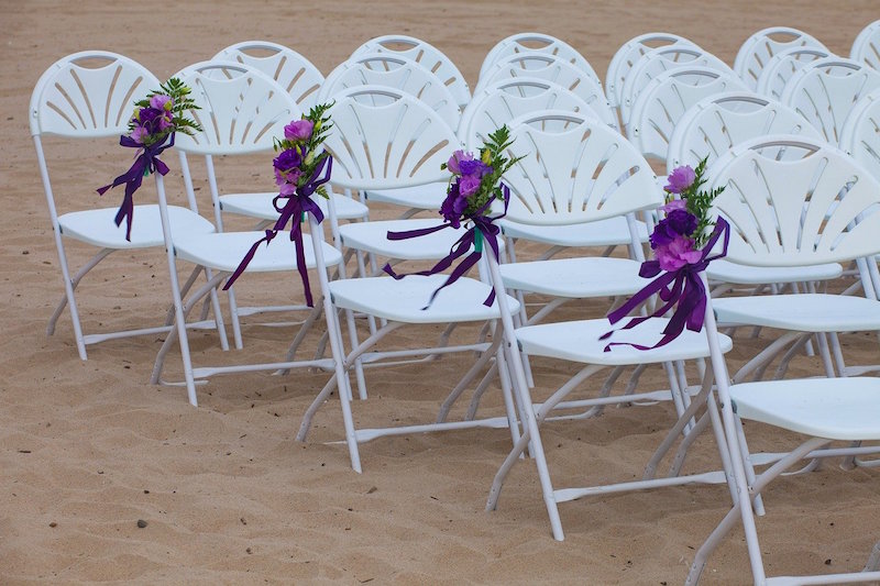 White chairs with purple flowers
