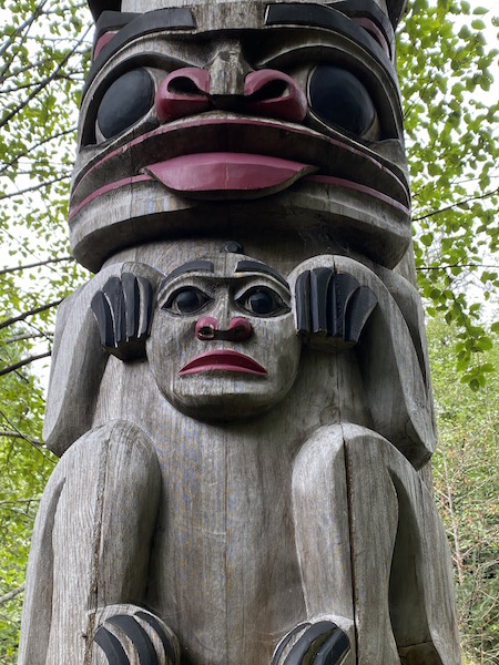 Bird like monkey totem pole