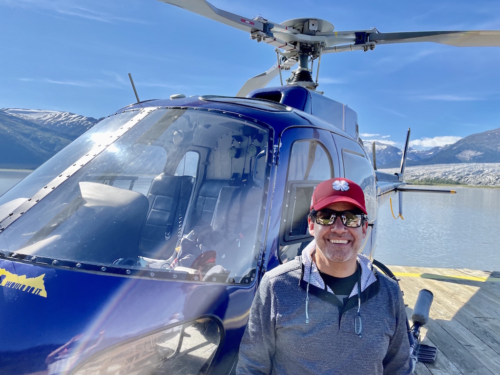 Patrick with helicopter in Alaska