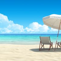 Chaise lounge and umbrella on sand beach, best scuba diving in Cancun, nightlife in Cancun, Cancun travel tips, Cancun winter