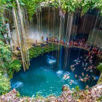 Ik-Kil Cenote Mexico, cenotes caves Mexico, things-that-represent-mexico, beach lady with hat in blue, A great family vacation on the beach, 3 kids, Relaxing Hamock, Best Excursions in Belize, are Tulum beaches open, best cenotes in Mexico,religion, famous things in Mexico, Cancun travel tips, Akumal Mexico snorkeling, chichen itza day trips