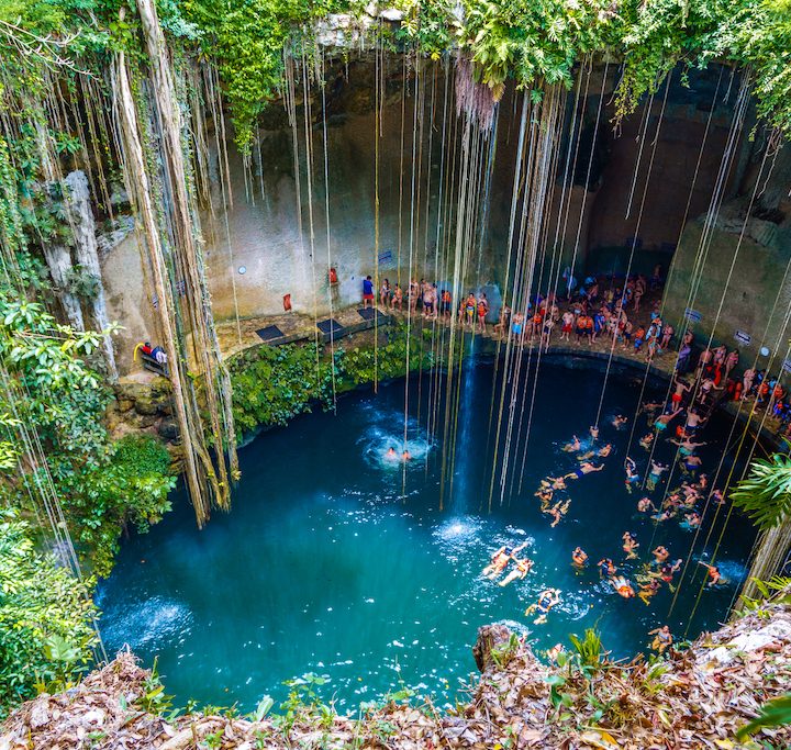 Ik-Kil Cenote Mexico, cenotes caves Mexico, things-that-represent-mexico, beach lady with hat in blue, A great family vacation on the beach, 3 kids, Relaxing Hamock, Best Excursions in Belize, are Tulum beaches open, best cenotes in Mexico,religion, famous things in Mexico, Cancun travel tips