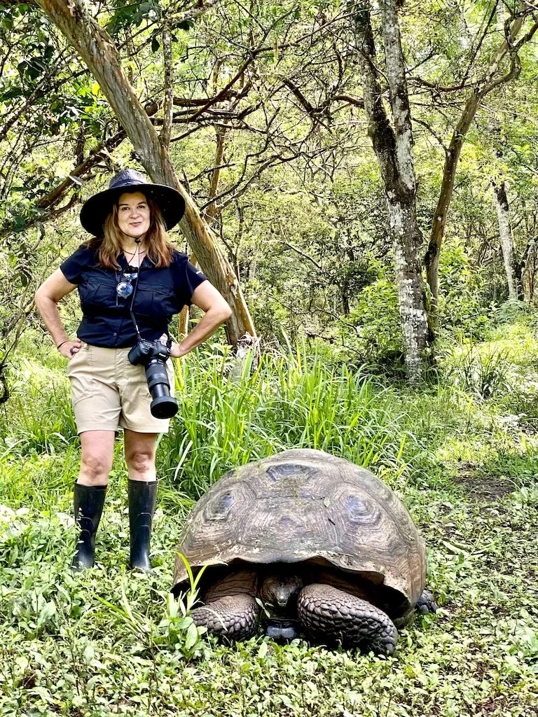 Cindy with a giant tortise, best city in ecuador