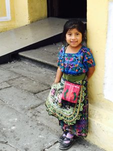 young girl, antigua guatemala things to do, curtains, antigua guatemala things to do, La ironia, Yazip mezcalm best mezcal from oaxaca, best restaurants in antigua guatemala, interesting-things-about-guatemala