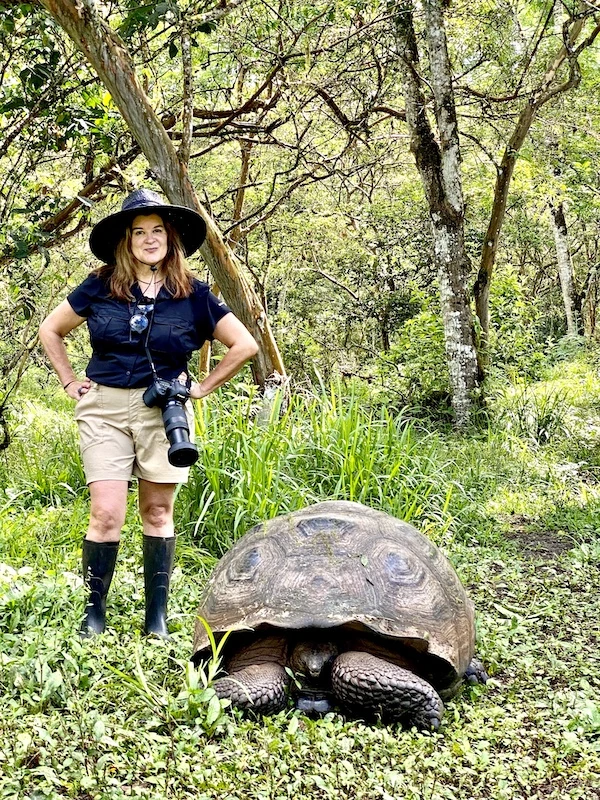 me with a tortoise, best way to get to galapagos islands