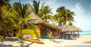 Tropical bar on a beach on Cozumel island, Mexico, Boat in Water in Cozumel, best food in Cozumel, are things cheaper in Mexico