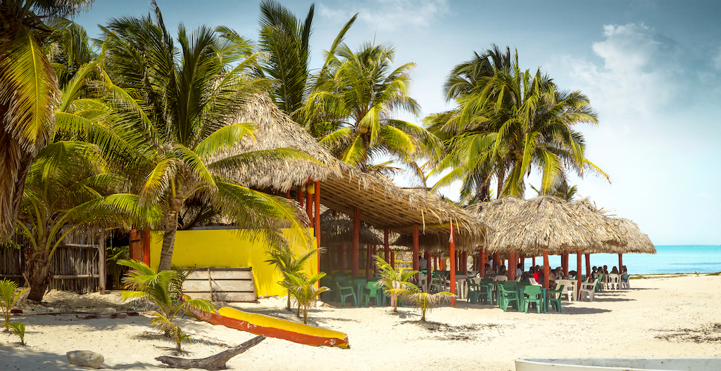 Tropical bar on a beach on Cozumel island, Mexico, Boat in Water in Cozumel, best food in cozumel