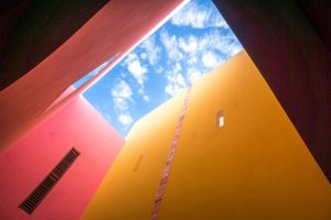 Red and yellow building, merida-Mexico, merida mexico beaches, mexico packing list, au naturel beaches caribbean