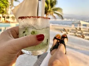 drink in hand at Banderas bay Puerto Vallarta, unique things to do in Puerto Vallarta