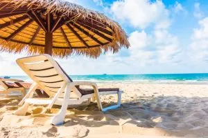 Umbrella and chair on the beach, downtown Cancun nightlife, nightlife in Cancun, hidden beaches Mexico