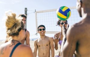 friends playing beach volley on the beach, best beaches in Panama City Florida