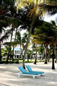 Belize snorkeling, two lounge chairs by the beach