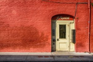 A red wall with a white door, best road trips from Louisiana