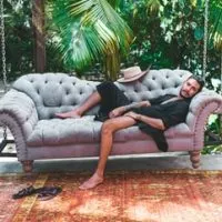 man on a couch, what to wear in Tulum