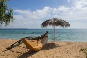 Sand and fishing boats on the beach, marietta islands, hidden beaches Mexico, 5-best-places-for-a-secluded-break, beaches Tulum resort, worst places to visit in Mexico, Aruba water activities, de palma island,  best time to visit Aruba