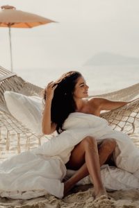 girl on a hammock on the beach, best beach clubs in Cancun
