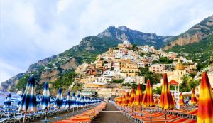 Amalfi Coast day trips form Rome, red and yellow and blue and white umbrellas, Amalfi coast, best holiday destinations for couples