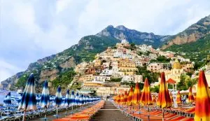Amalfi Coast day trips form Rome, red and yellow and blue and white umbrellas, Amalfi coast, best holiday destinations for couples