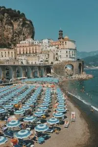 Amalfi Coast day trips form Rome, blue and white umbrellas,  6 Best Road Trips in Italy