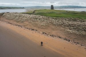 a castle near a man, haunted places in Ireland