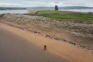 a castle near a man, haunted places in Ireland