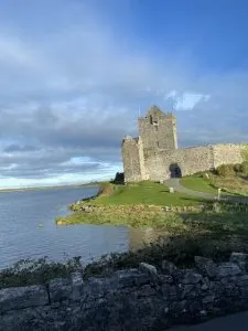 a castle with grass, family trip to Ireland